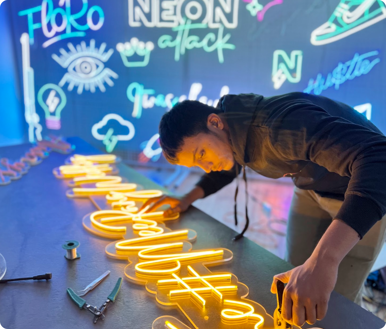 Person crafting neon sign